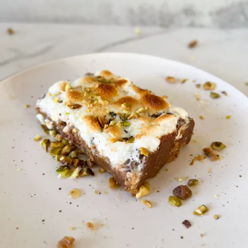 Gulab jamun s’mores bar on a white plate