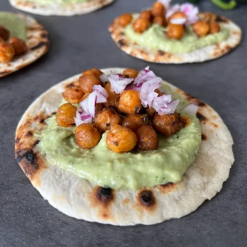 Chana tacos with spiced chickpeas and avocado crema on flatbreads